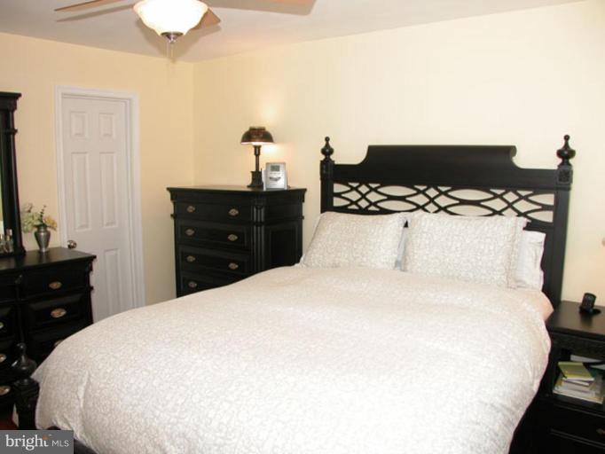 724 West Glebe Road Alexandria, VA 22305 - Photo 11 of 20 a bedroom with a bed and a dresser