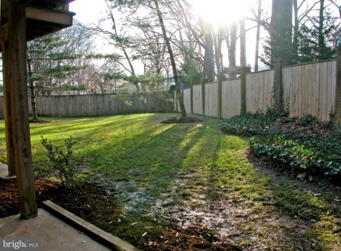 724 West Glebe Road Alexandria, VA 22305 - Photo 18 of 20 a view of a yard with plants and wooden fence