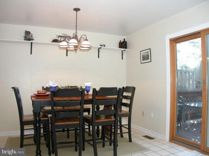724 West Glebe Road Alexandria, VA 22305 - Photo 8 of 20 a view of a dining room with furniture window and wooden floor