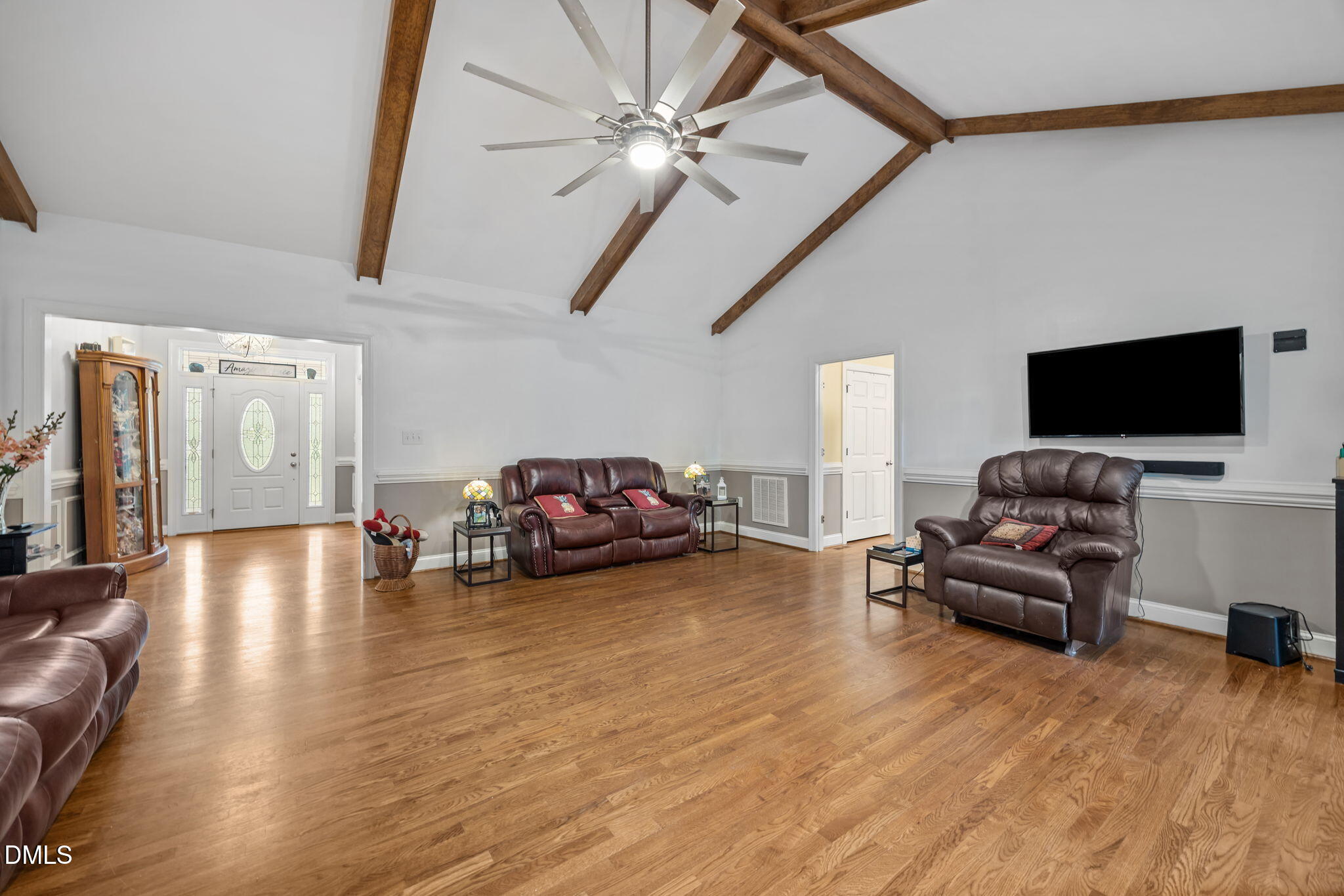 2880 Elevation Road Four Oaks, NC 27524 - Photo 12 of 51 a living room with furniture and a flat screen tv