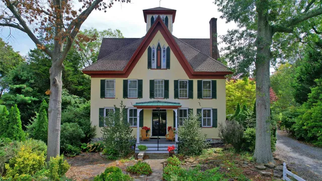 a front view of a house with garden