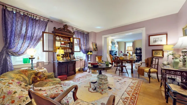 a view of a dining room with furniture and chandelier