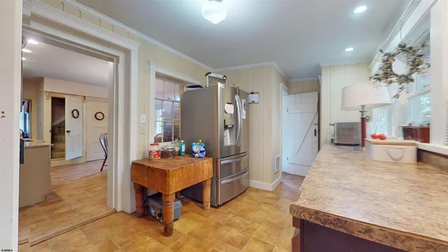 a bathroom with a sink and bathtub with toilet