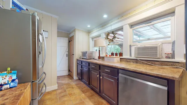 a view of a room with gym equipment and a window