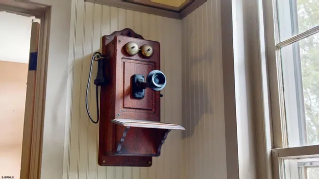 an aerial view of residential house with outdoor space and trees all around