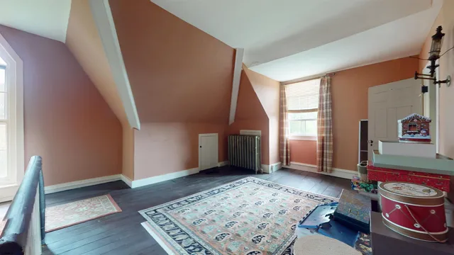 an aerial view of residential house with outdoor space and trees all around