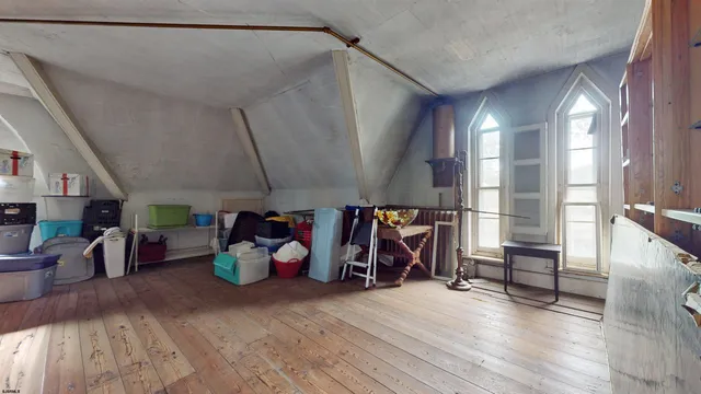 an aerial view of a house with a lake view