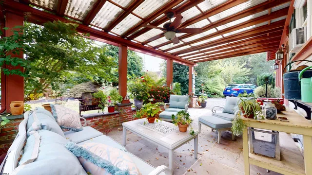 a close up of a vase of flowers sitting on a table