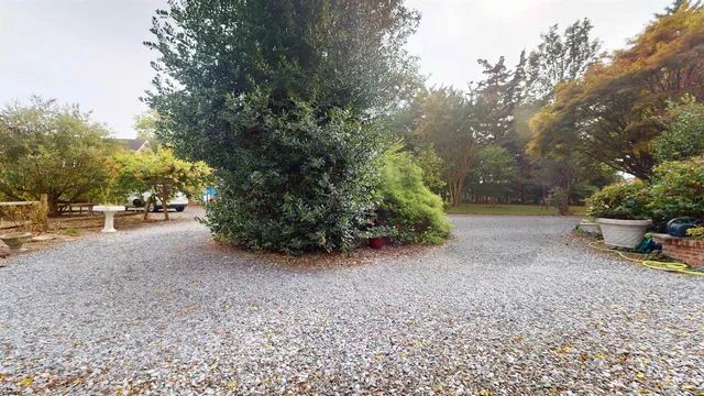 a picture of a building with a white wall