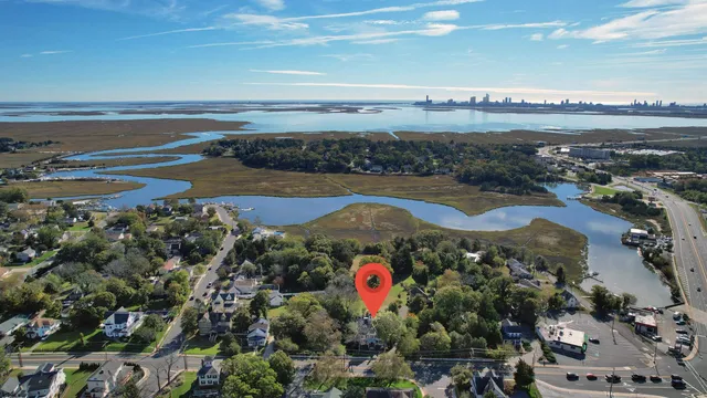 a living room with furniture and large windows