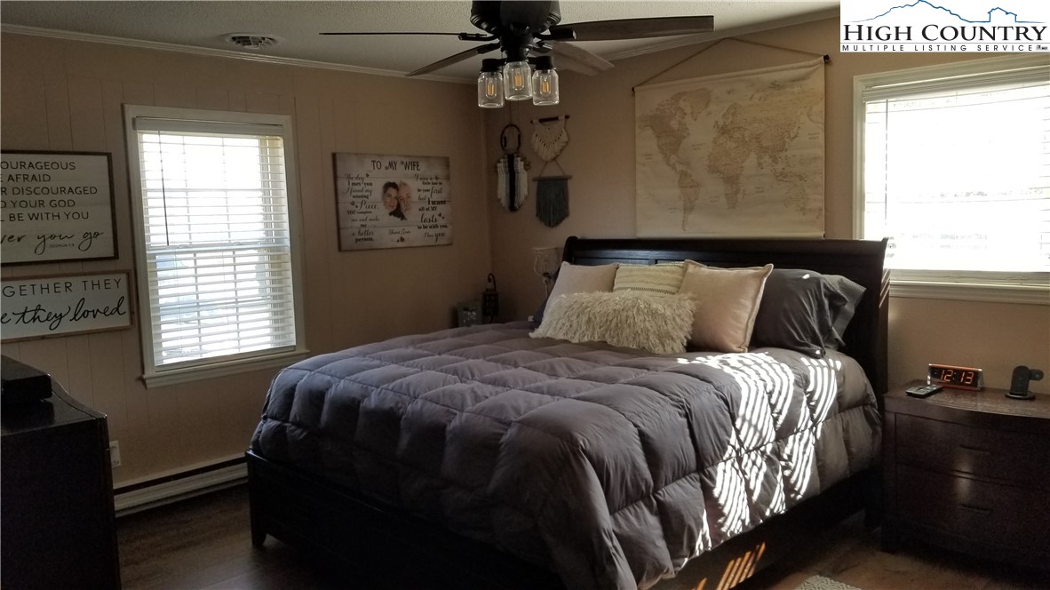 4202 Ridgeglen Road Sparta, NC 28675 - Photo 12 of 22 a bedroom with a bed and a window