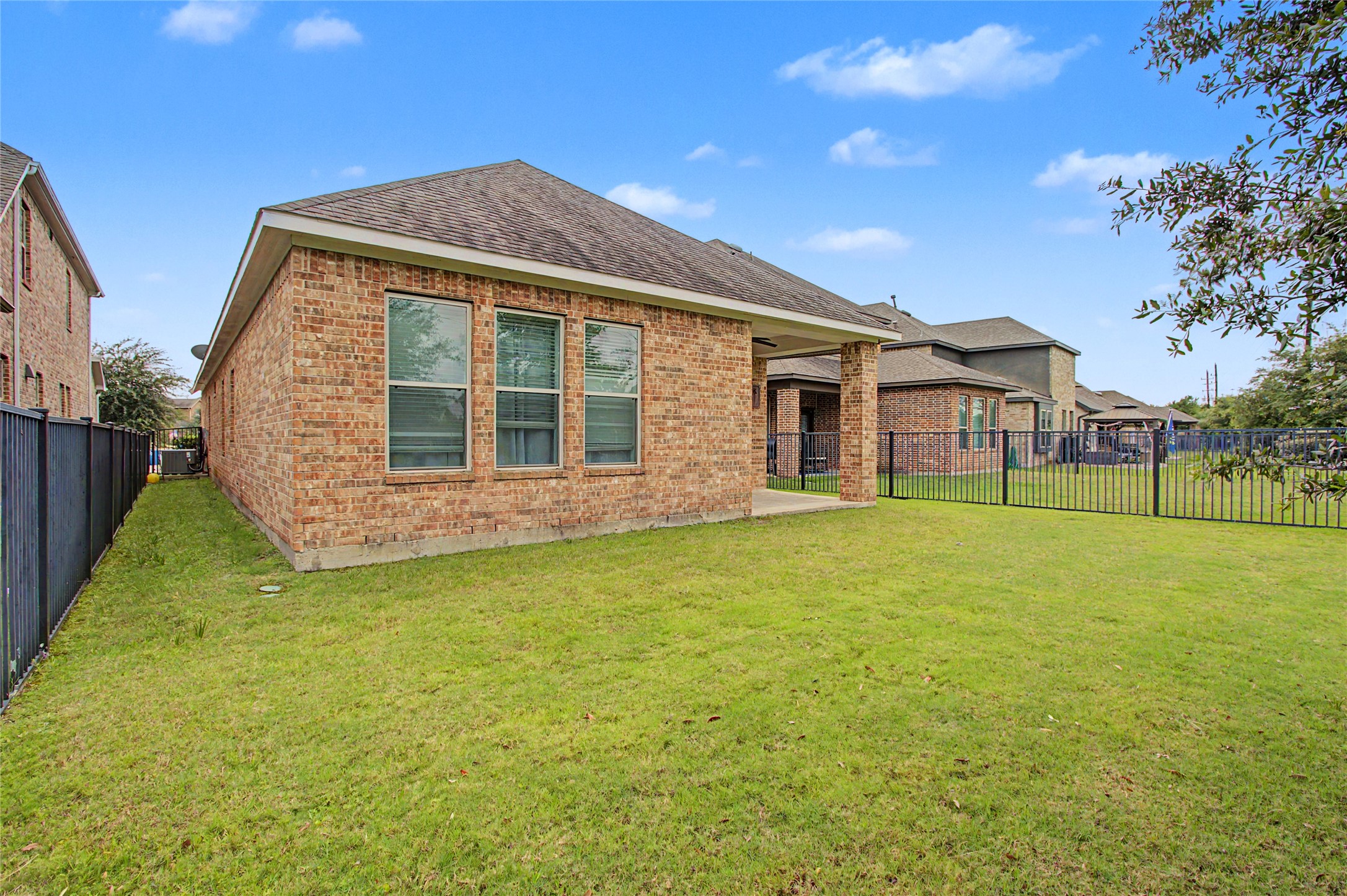 19718 Shinnery Ridge Court Cypress, TX 77433 - Photo 21 of 23 a view of a house with backyard and garden