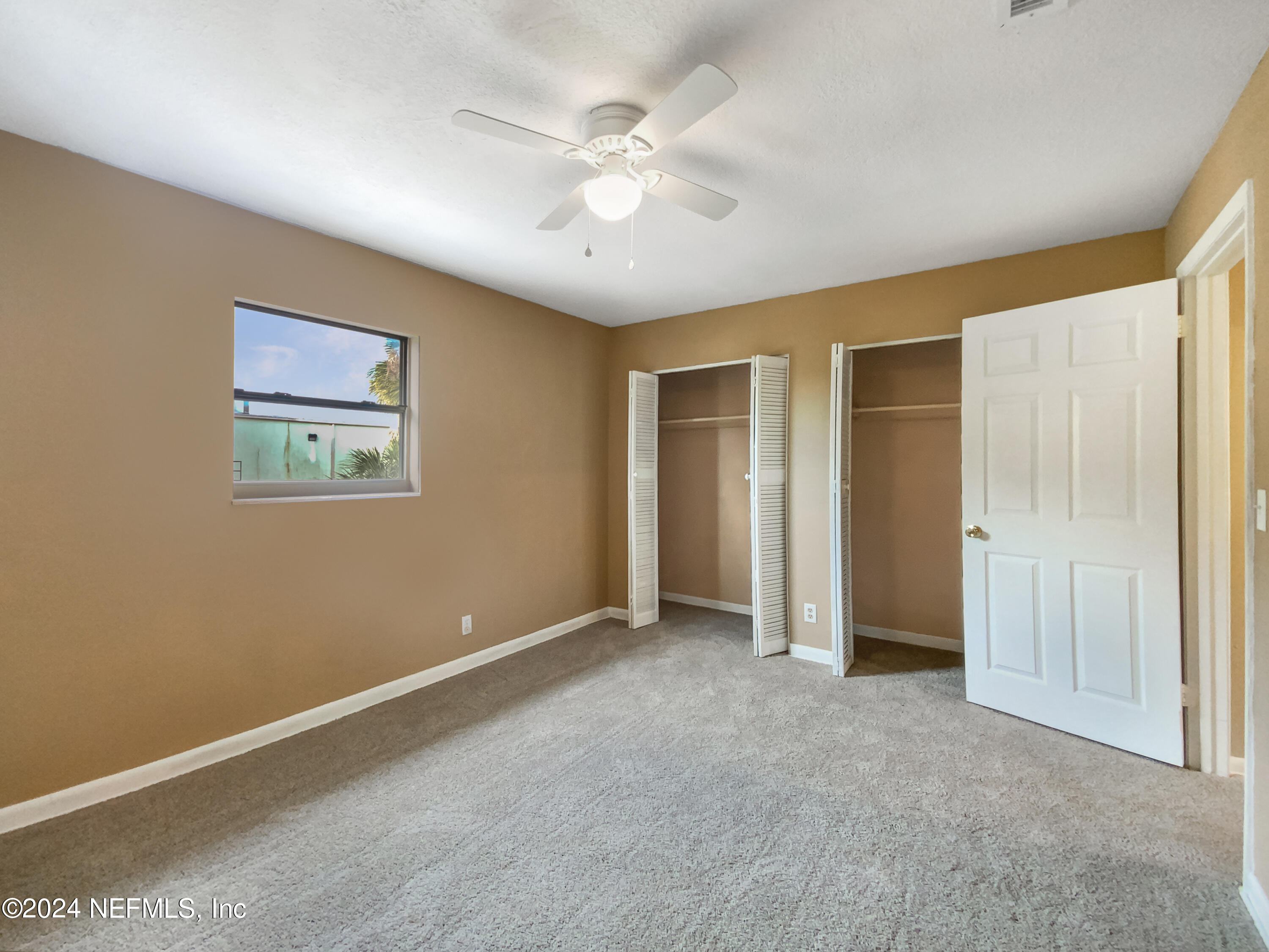 710 Cavalla Road Atlantic Beach, FL 32233 - Photo 13 of 17 an empty room with closet and ceiling fan