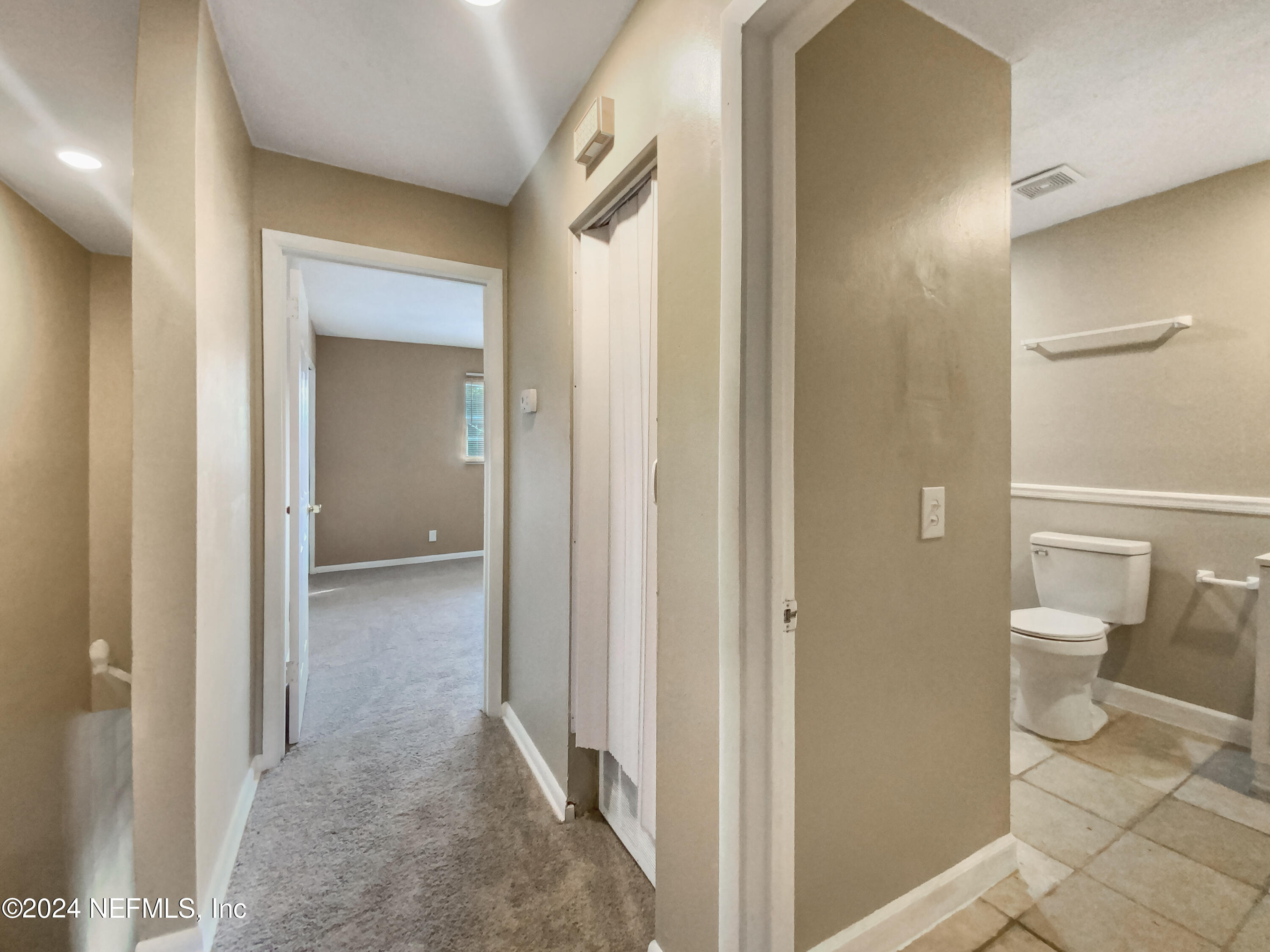 710 Cavalla Road Atlantic Beach, FL 32233 - Photo 14 of 17 a view of a bathroom with a toilet and a shower