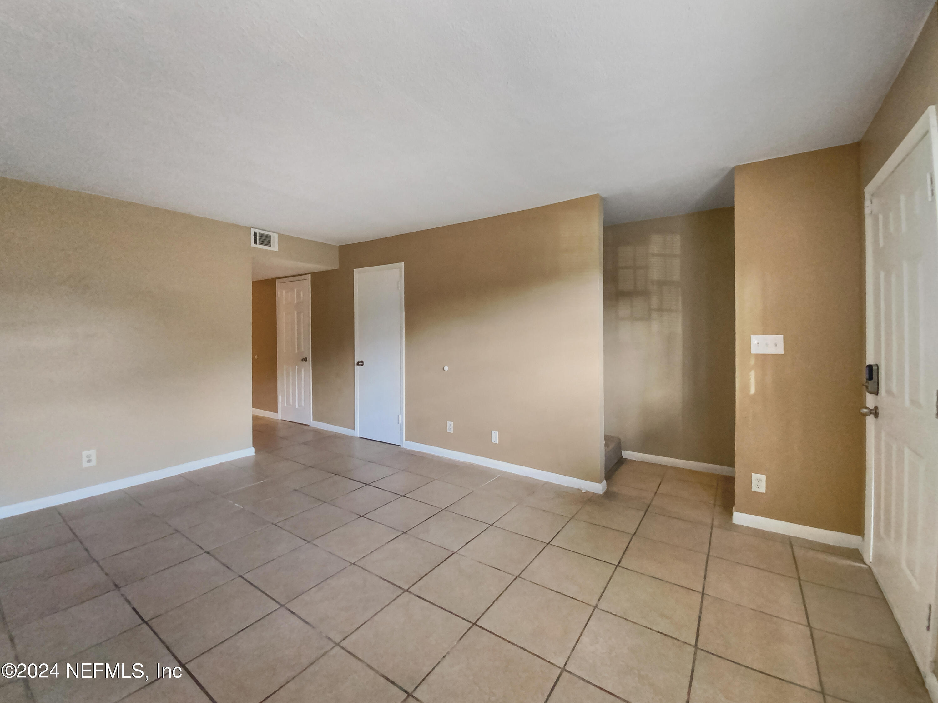 710 Cavalla Road Atlantic Beach, FL 32233 - Photo 5 of 17 a view of an empty room with window