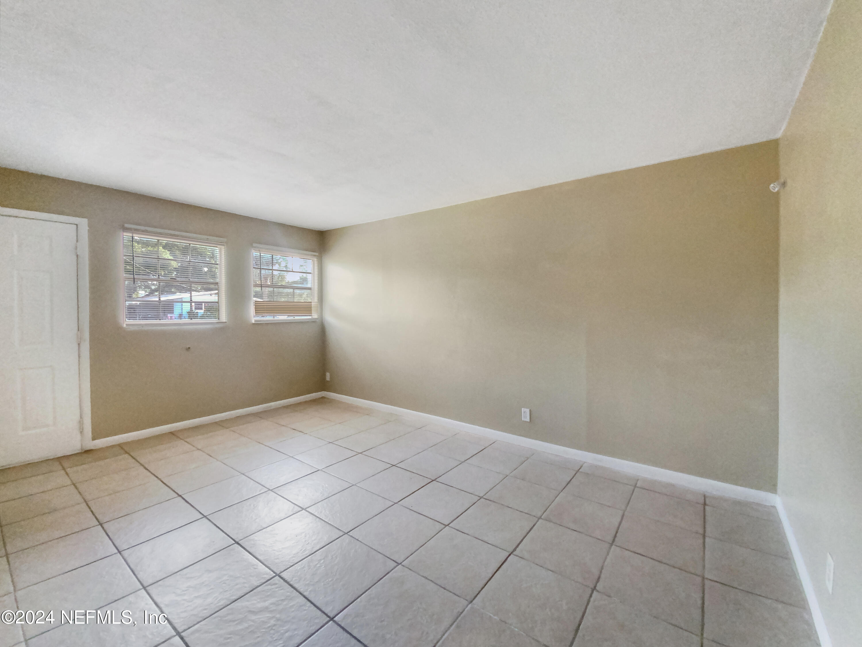710 Cavalla Road Atlantic Beach, FL 32233 - Photo 6 of 17 a view of an empty room with windows