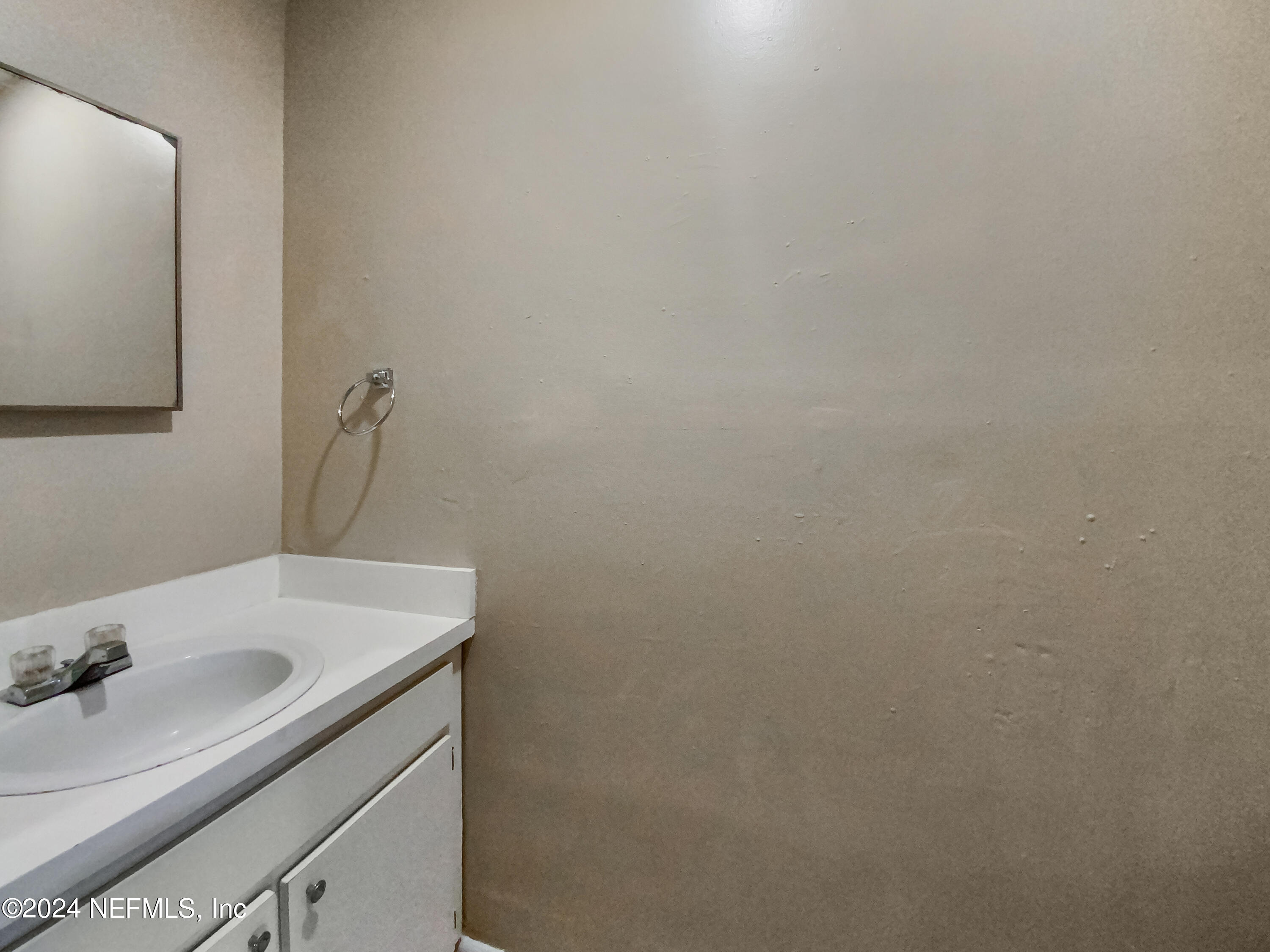 710 Cavalla Road Atlantic Beach, FL 32233 - Photo 7 of 17 a bathroom with a sink and a mirror
