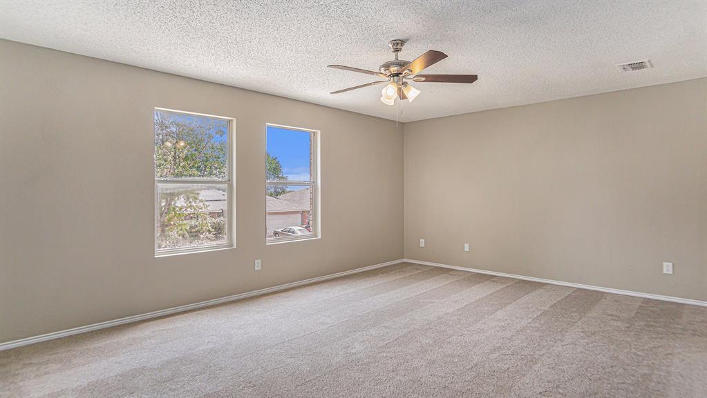 8732 Hunters Point Way Fort Worth, TX 76123 - Photo 14 of 24 a view of an empty room with a window