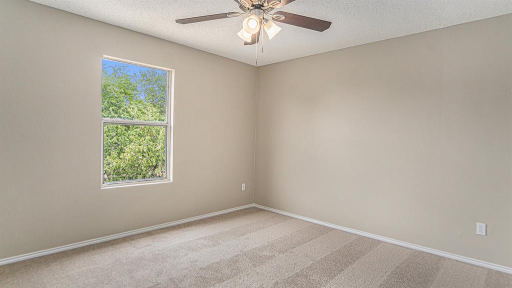 8732 Hunters Point Way Fort Worth, TX 76123 - Photo 18 of 24 an empty room with a window