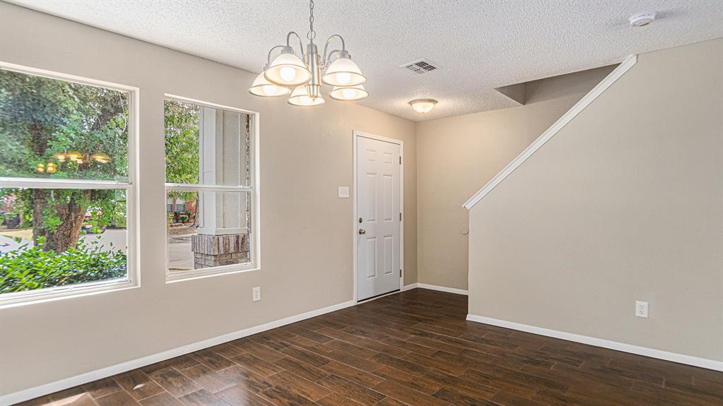 8732 Hunters Point Way Fort Worth, TX 76123 - Photo 9 of 24 a view of livingroom with hardwood floor and window