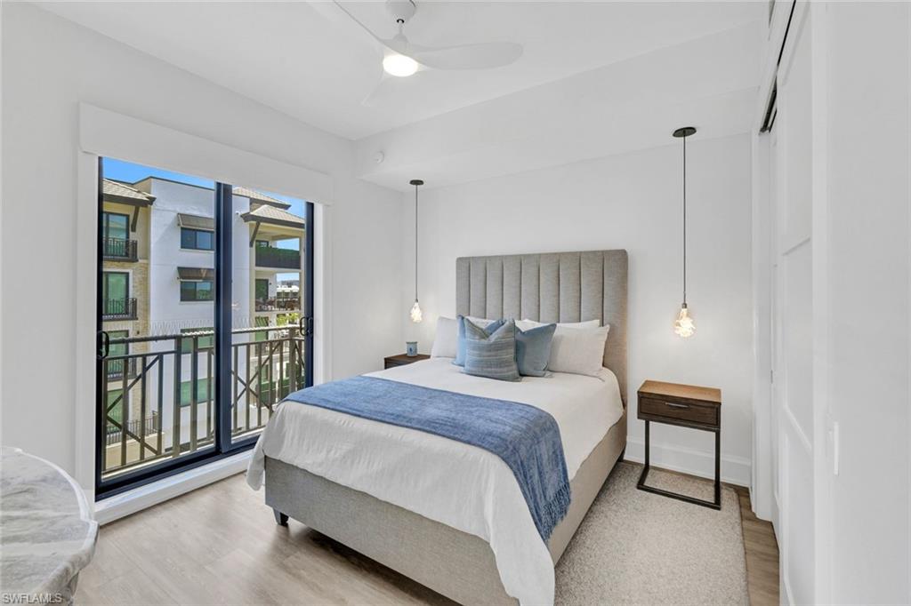 1030 3rd Avenue South, Unit 419 Naples, FL 34102 - Photo 13 of 29 a bedroom with a bed and a window