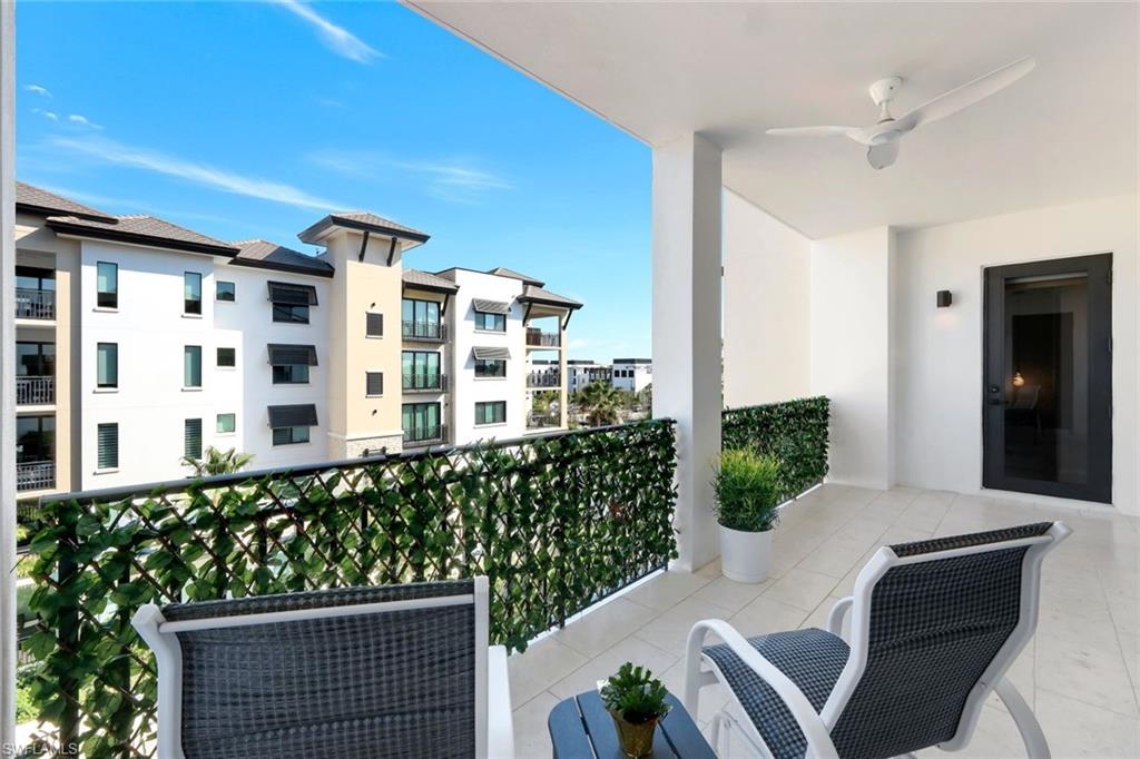 1030 3rd Avenue South, Unit 419 Naples, FL 34102 - Photo 16 of 29 a view of a balcony with chairs