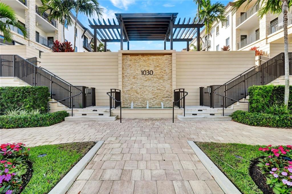 1030 3rd Avenue South, Unit 419 Naples, FL 34102 - Photo 18 of 29 a view of a backyard with potted plants