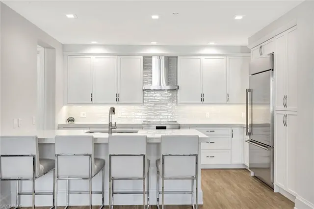 a living room with furniture and white walls