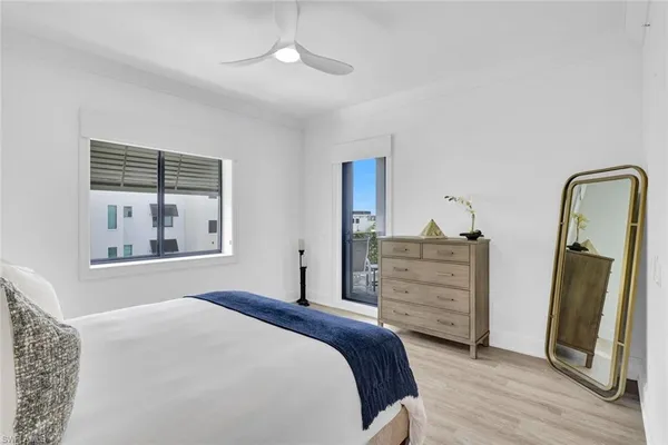a bedroom with a bed and a dresser