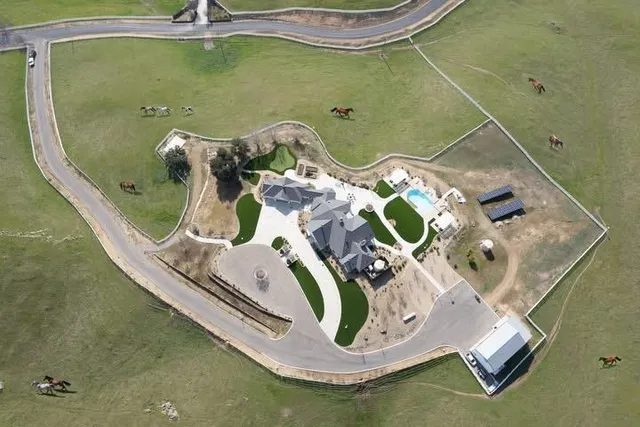 a view of yard with swimming pool