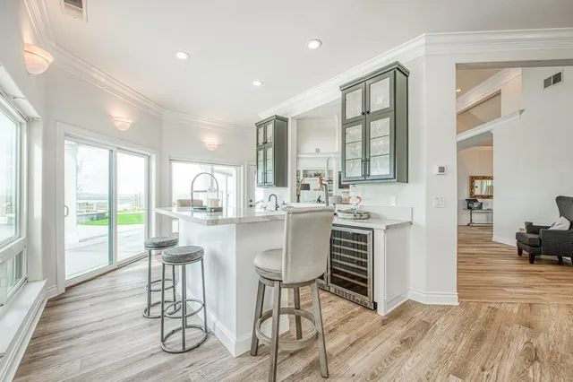 a view of living room with furniture and a fireplace