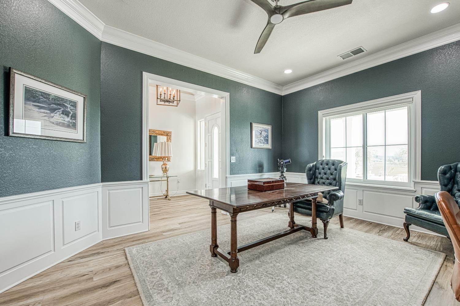 18300 Watts Valley Road Sanger, CA 93657 - Photo 19 of 78 a view of a workspace with furniture and a window