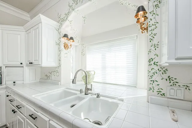 a view of a patio with a table and chairs under an umbrella