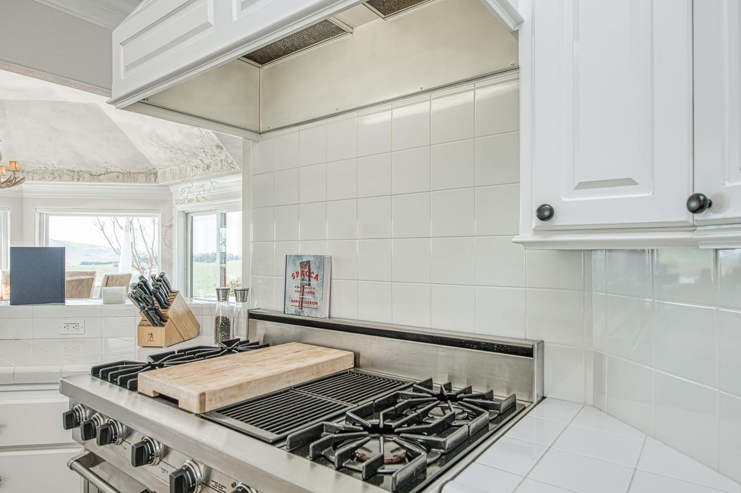 18300 Watts Valley Road Sanger, CA 93657 - Photo 27 of 78 a bed sitting in a kitchen next to a window