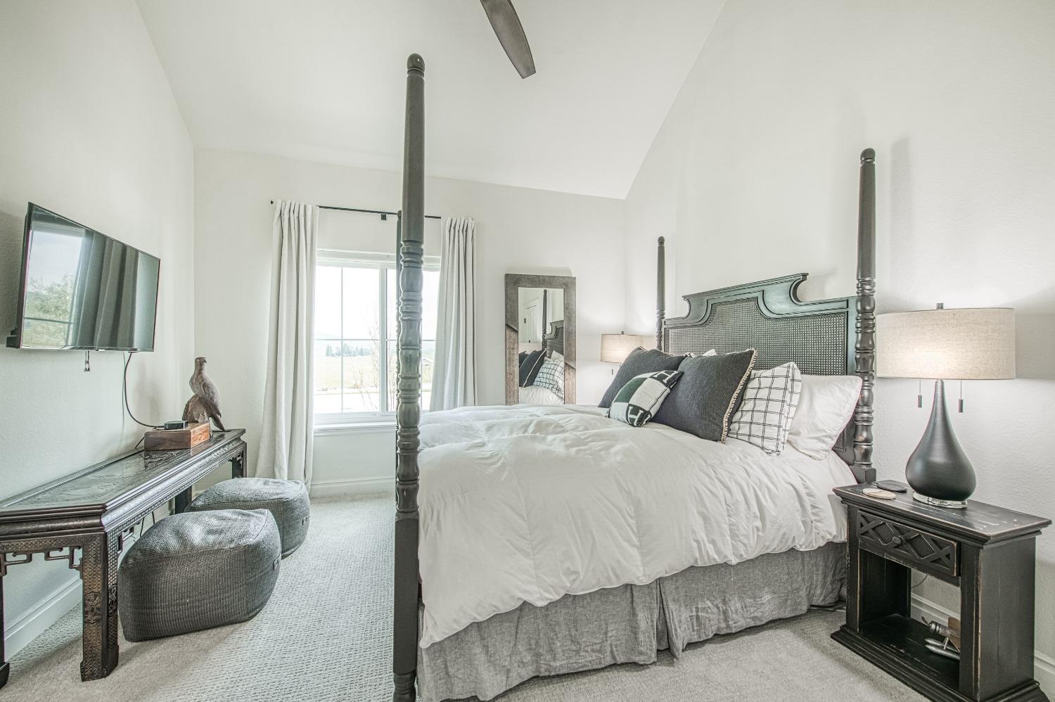 18300 Watts Valley Road Sanger, CA 93657 - Photo 34 of 78 a bedroom with a bed a flat screen tv and next to a window