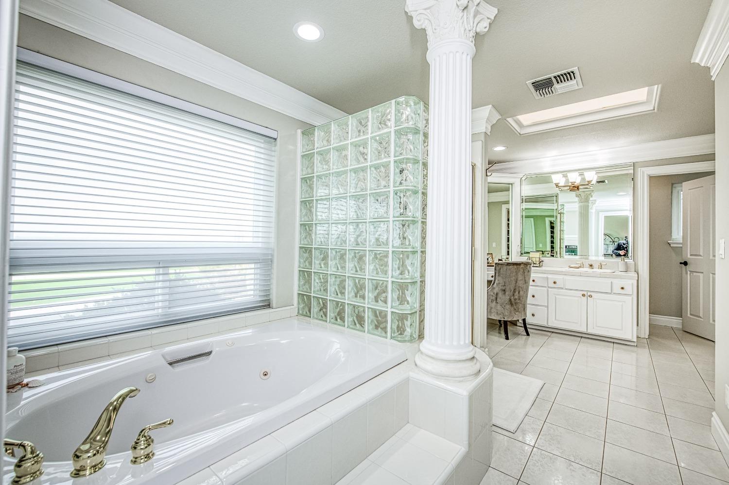 18300 Watts Valley Road Sanger, CA 93657 - Photo 45 of 78 a bathroom with a bathtub and a shower