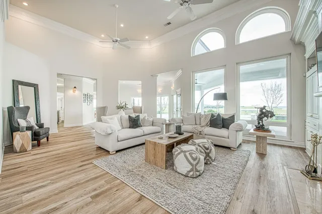 a living room with furniture and a bookshelf