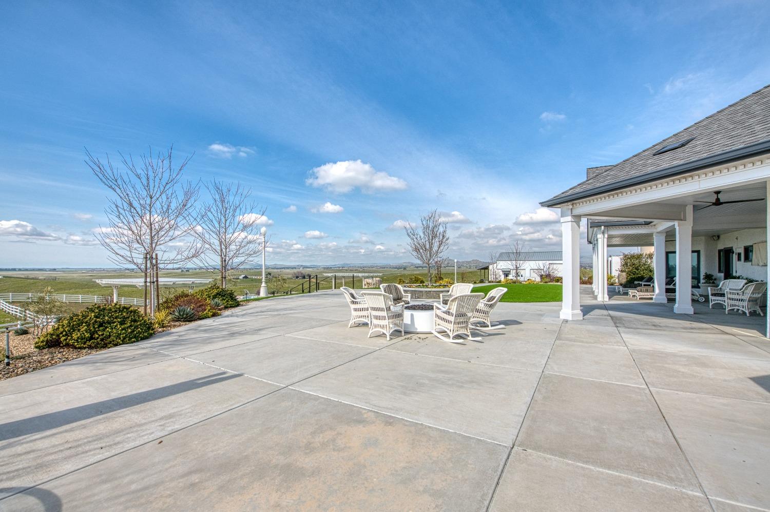 18300 Watts Valley Road Sanger, CA 93657 - Photo 73 of 78 a view of a patio with a table and chairs under an umbrella