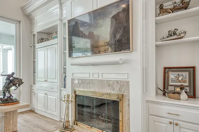 a kitchen with white cabinets sink and white appliances