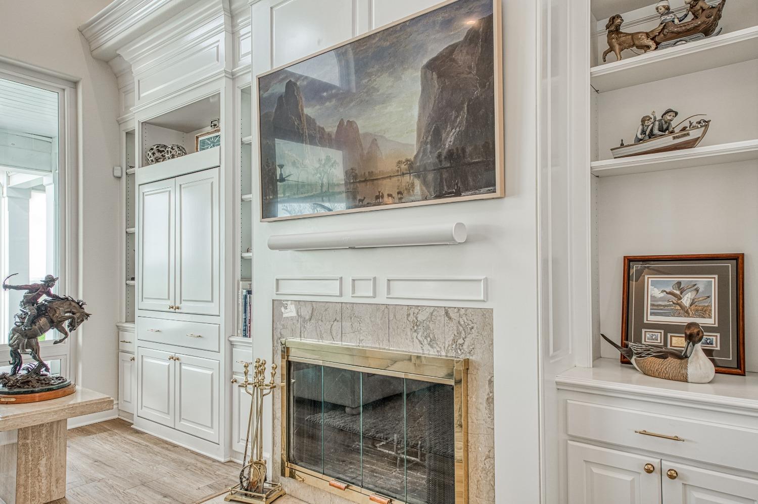 18300 Watts Valley Road Sanger, CA 93657 - Photo 9 of 78 a living room with a fireplace and windows