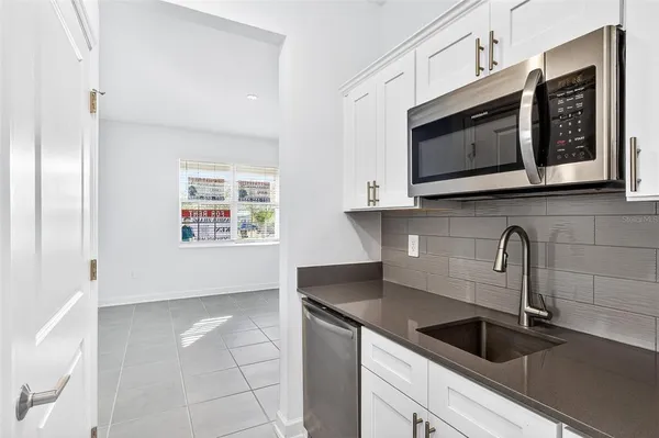 a view of a house with a yard and a garden