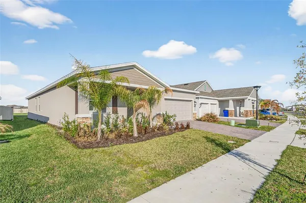 a kitchen with granite countertop a stove and a sink