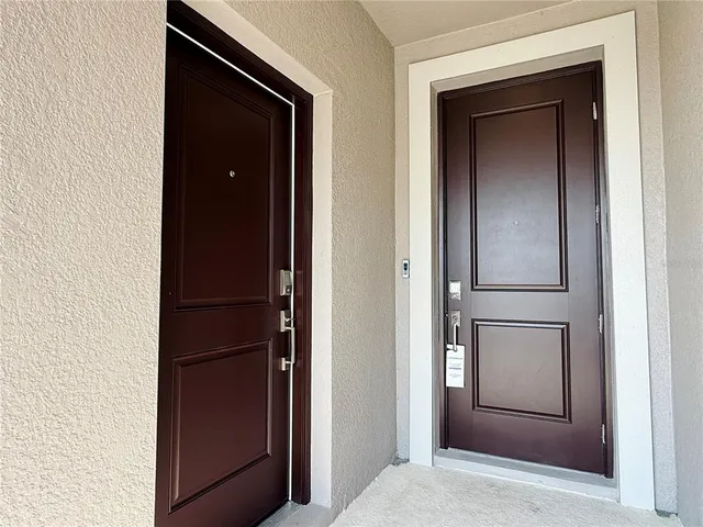 a kitchen with stainless steel appliances granite countertop a refrigerator a stove top oven a sink and cabinets