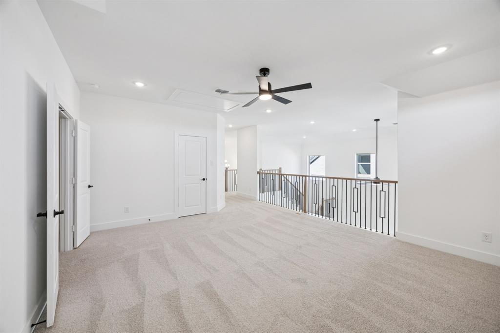 3412 Aldrich Road McKinney, TX 75071 - Photo 23 of 38 a view of a hallway with a ceiling fan