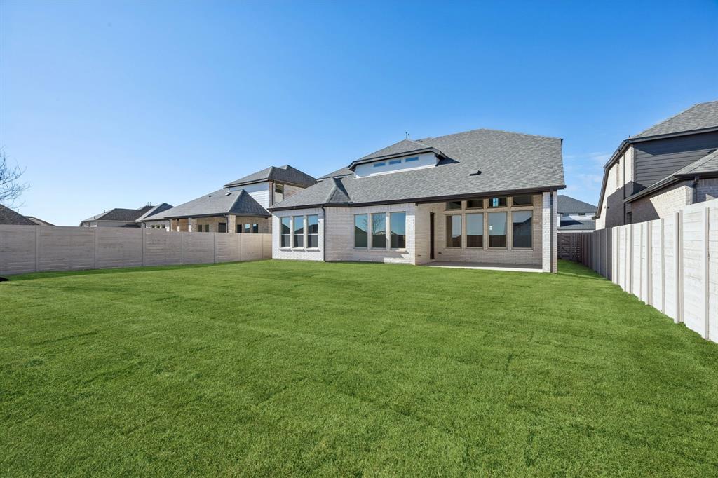 3412 Aldrich Road McKinney, TX 75071 - Photo 30 of 38 a view of a house with a backyard