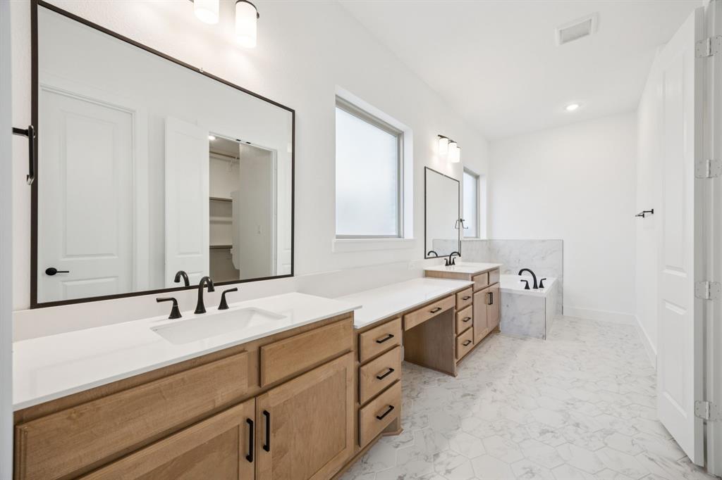 3412 Aldrich Road McKinney, TX 75071 - Photo 3 of 38 a bathroom with a double vanity sink mirror and