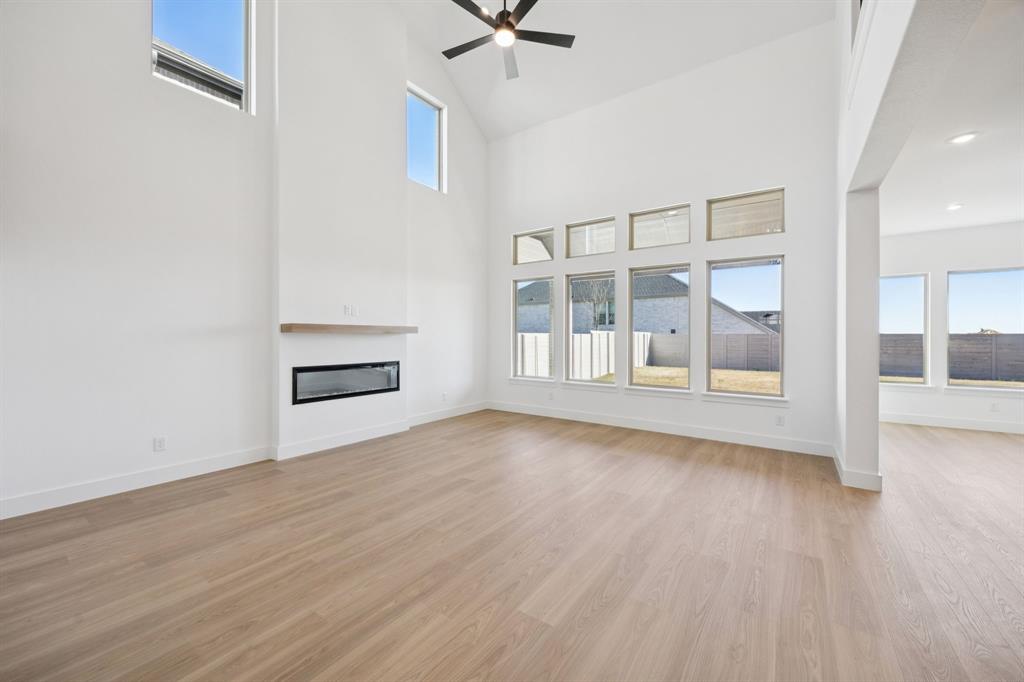 3412 Aldrich Road McKinney, TX 75071 - Photo 4 of 38 wooden floor in an empty room with a window
