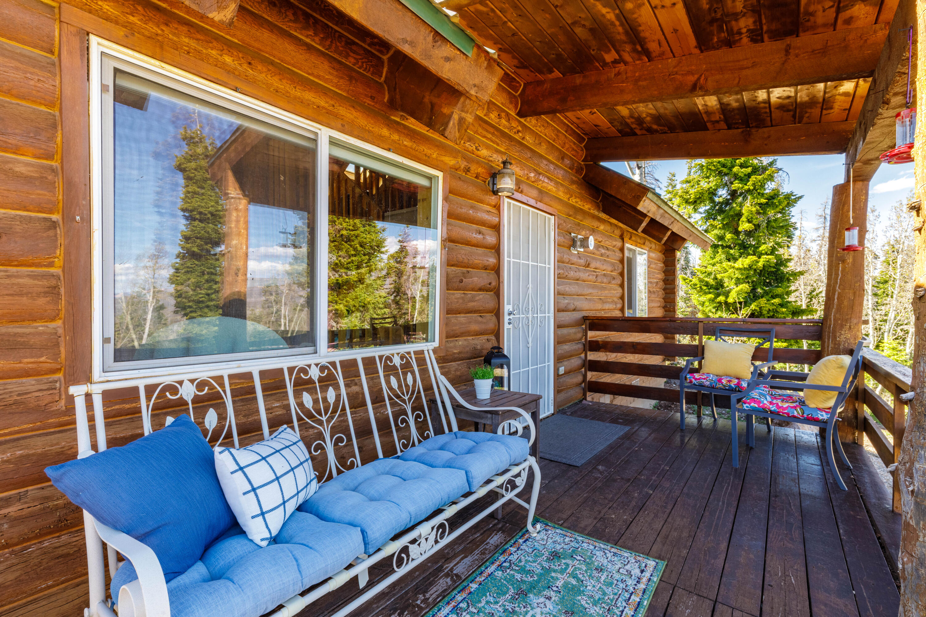 706 West Tranquility Drive Springdale, UT 84767 - Photo 4 of 58 Covered Porch Seating: Relaxing outdoor lounge area on the wrap-around deck.