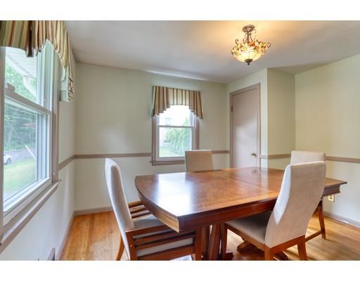 72 Burt Road Springfield, MA 01118 - Photo 6 of 19 a view of a dining room with furniture and wooden floor