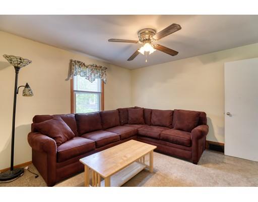 72 Burt Road Springfield, MA 01118 - Photo 10 of 19 a living room with furniture a ceiling fan and a window